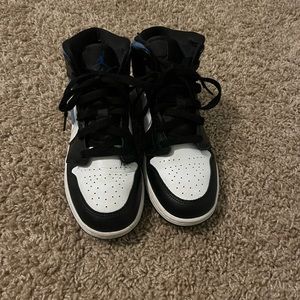 Size 4.5y “Jordan 1 mids”.